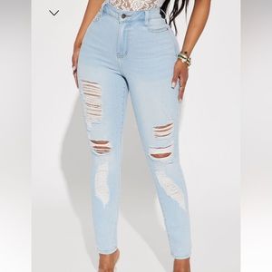 Light wash distressed skinny jeans